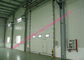 ประตูโรงรถอุตสาหกรรมยกเครื่องยนต์แนวตั้งยกด้วยหน้าต่างโปร่งใสและทางเดินเท้า ผู้ผลิต